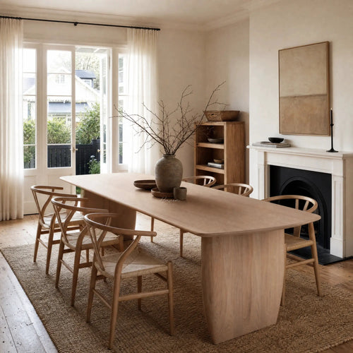 Alva Dining Table in a Nordic dining room; solid ash with milkwash finish, surrounded by matching chairs.