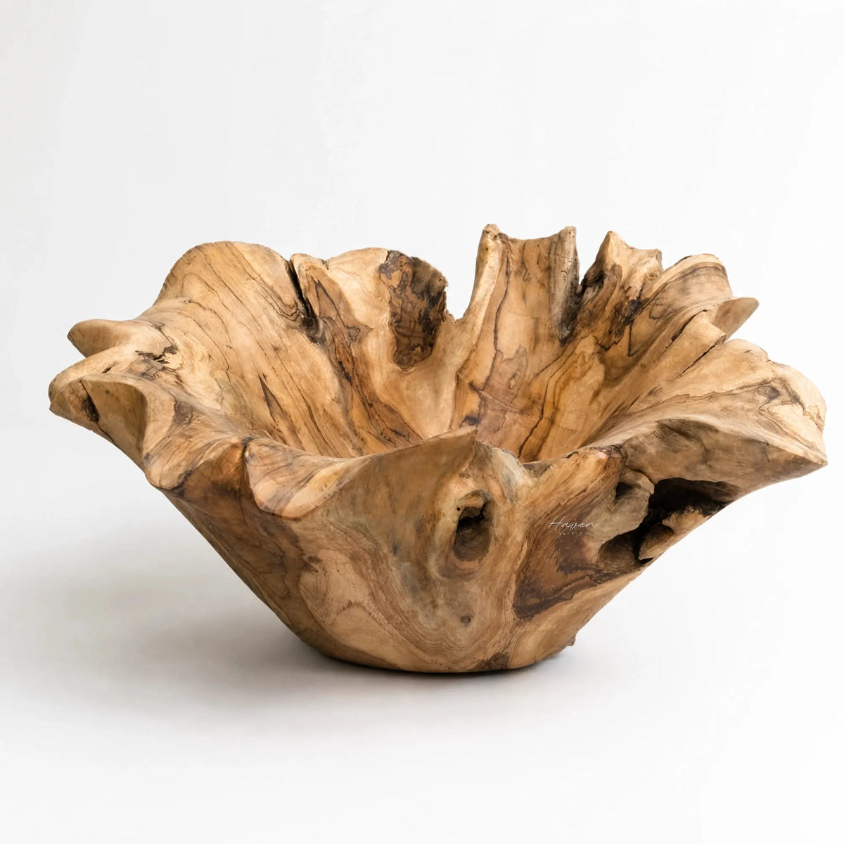One-of-a-kind teak bowl, hand-carved from reclaimed teak, showing natural grain and organic edges