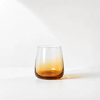 Broste Tumbler Set/8 - Amber: eight mouthblown glasses with a warm amber base.
