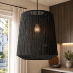Black Ren Lampshade with woven jute texture, diffused warm light for a cozy, modern interior.