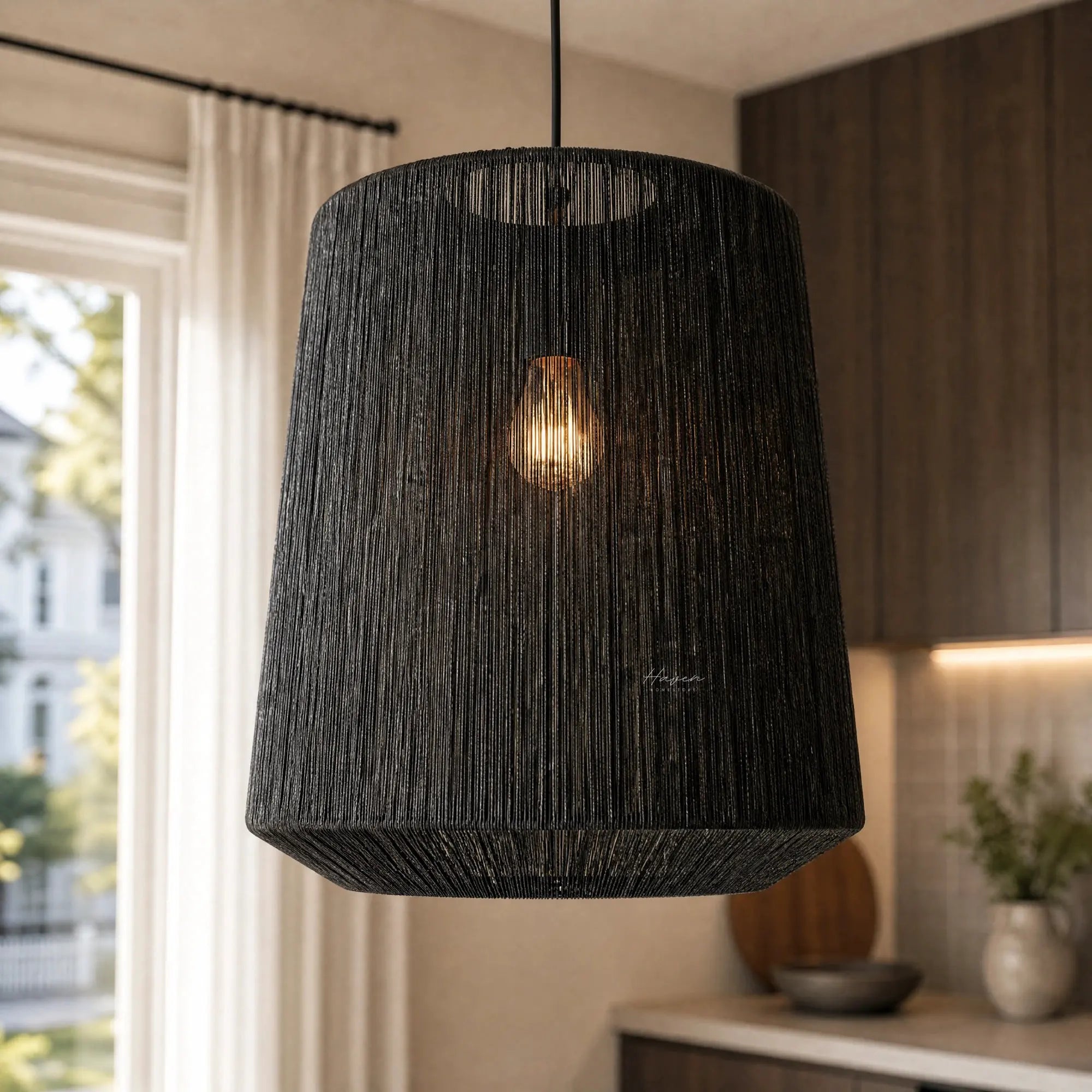 Black Ren Lampshade with woven jute texture, diffused warm light for a cozy, modern interior.