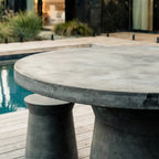 Broste® Outdoor Dining Table with sculptural pedestal bases in concrete-like fiberclay