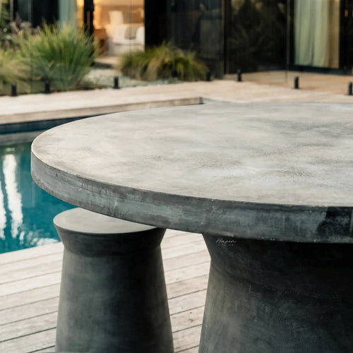 Broste® Outdoor Dining Table with sculptural pedestal bases in concrete-like fiberclay