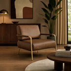 Pure Sinclair Leather Chair with brass frame in a warm living room, Italian buffalo leather.