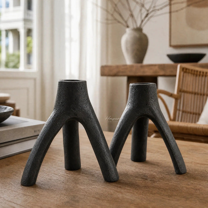 MUUBS Aion Candleholder Set/2 in black cast iron, tree-branch silhouette, sculptural decor.