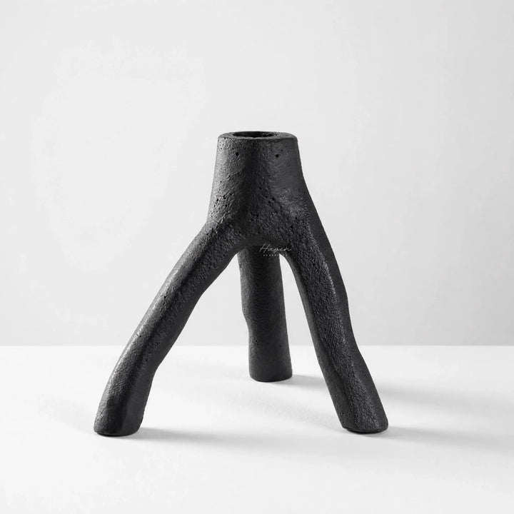 MUUBS Aion Candleholder Set/2 in black cast iron with a tree-branch inspired, three-legged sculptural form