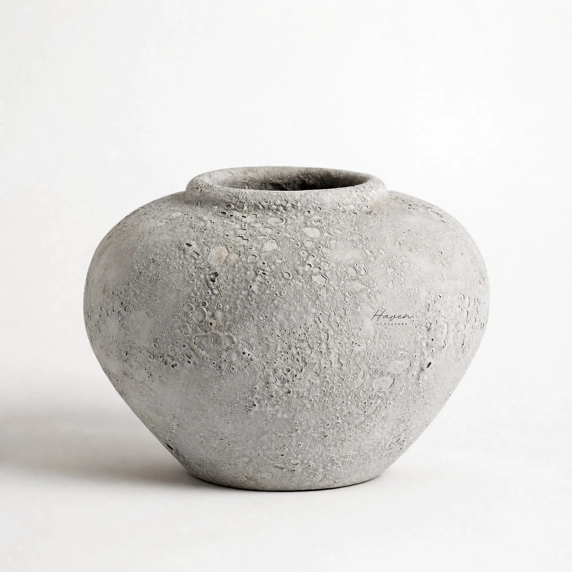 MUUBS Pot Luna 18 - Grey, spherical ceramic pot with cratered texture.