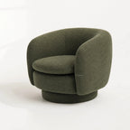 Monika Swivel Chair with a soft sculptural silhouette, curved back, and swivel base.