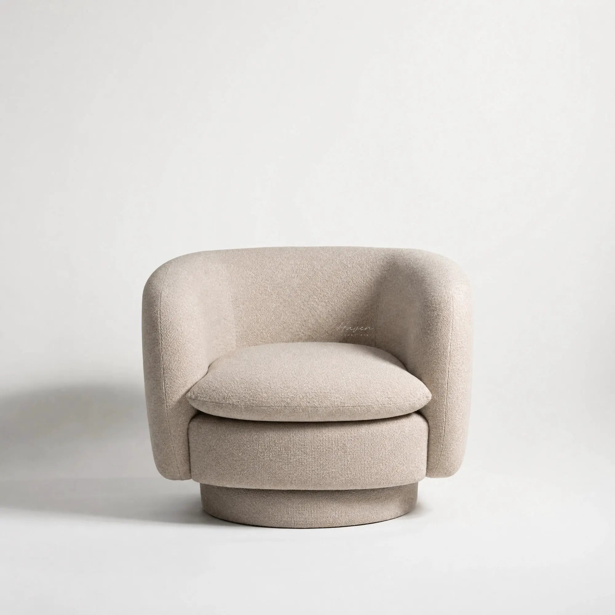 Monika Swivel Chair - Latte: soft beige fabric, curved back, and swivel base.