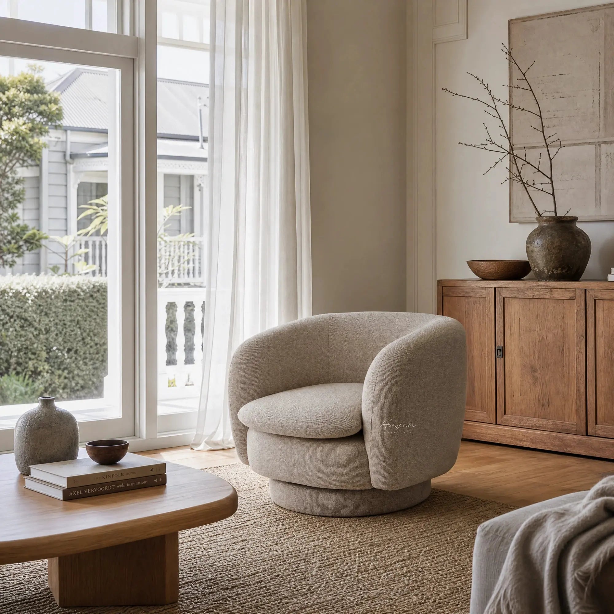 Monika Swivel Chair - Latte with a soft sculptural silhouette, curved back, and swivel base in a cozy living room.