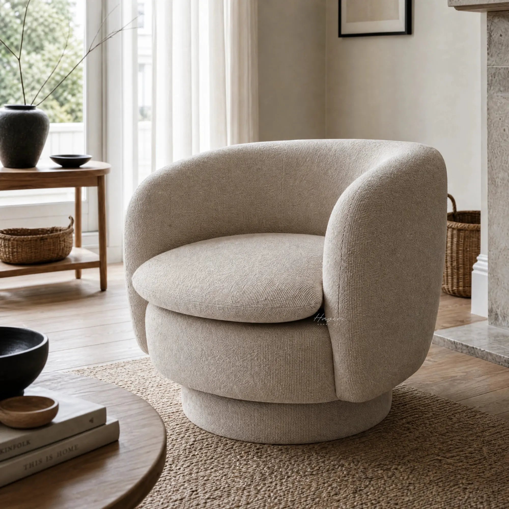 Monika Swivel Chair in Latte with a soft curved back in a bright, neutral living room