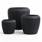 Piha Planters Set/3: trio of dark, matte stone-composite planters for indoor or outdoor spaces.