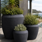 Piha Planters Set/3 in premium stone composite with sculptural form and lush greenery.