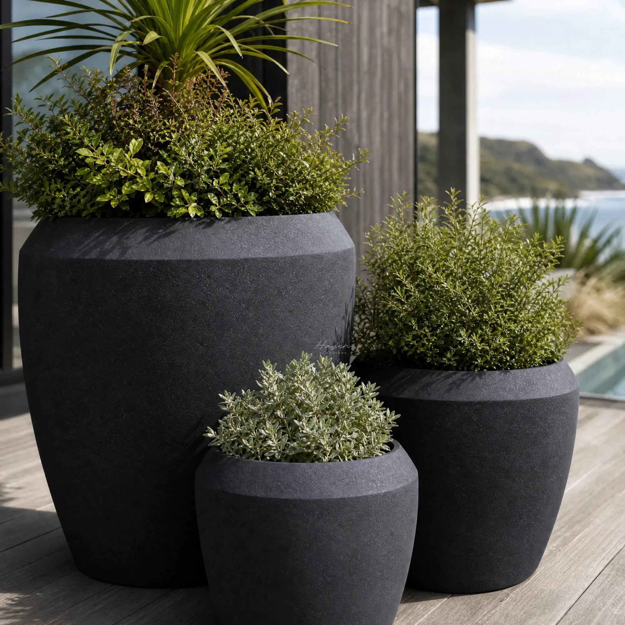 Piha Planters Set/3 in premium stone composite with sculptural form and lush greenery.