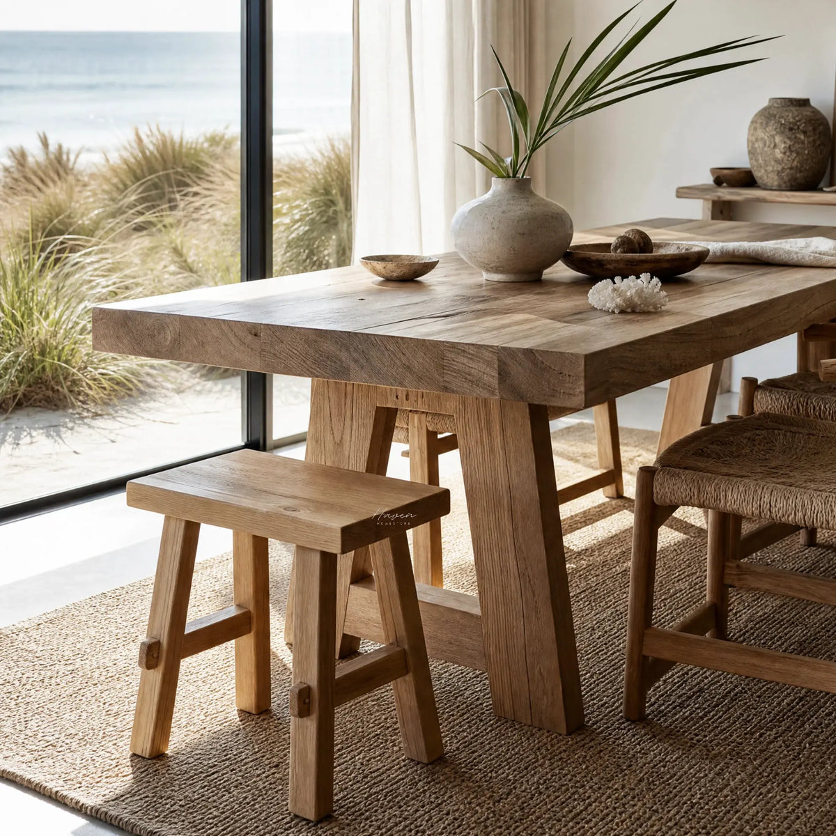 Asken Side Table / Stool in reclaimed elm, showing distinctive grain, knots and time-worn markings in a sunlit room.