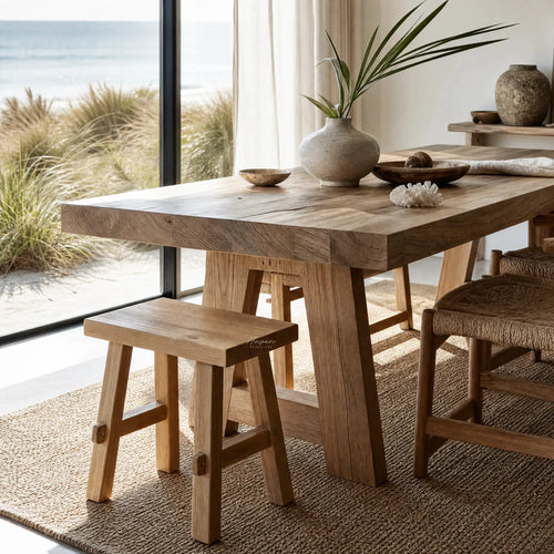 Asken Side Table / Stool in reclaimed elm, showing distinctive grain, knots and time-worn markings in a sunlit room.