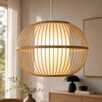 Kura Pendant Light: bamboo open-weave shade with diffused inner glow, warm ambient light.