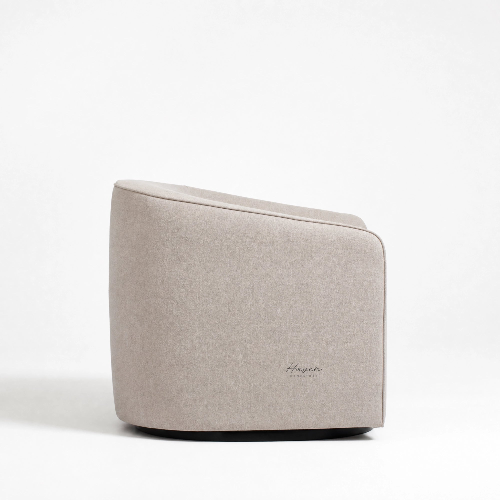 Annika Swivel Chair with soft curved silhouette, smooth swivel base, and textured beige polyester upholstery
