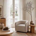 Annika Swivel Chair with softly curved silhouette and textured polyester upholstery in a cozy living room.