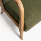 Tairua Lounge Chair in Seagrass with limewashed oak frame and textured green upholstery.