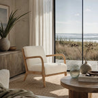 Pair of Tairua Lounge Chairs in Seafoam upholstery with limewashed oak frames in a coastal living room.