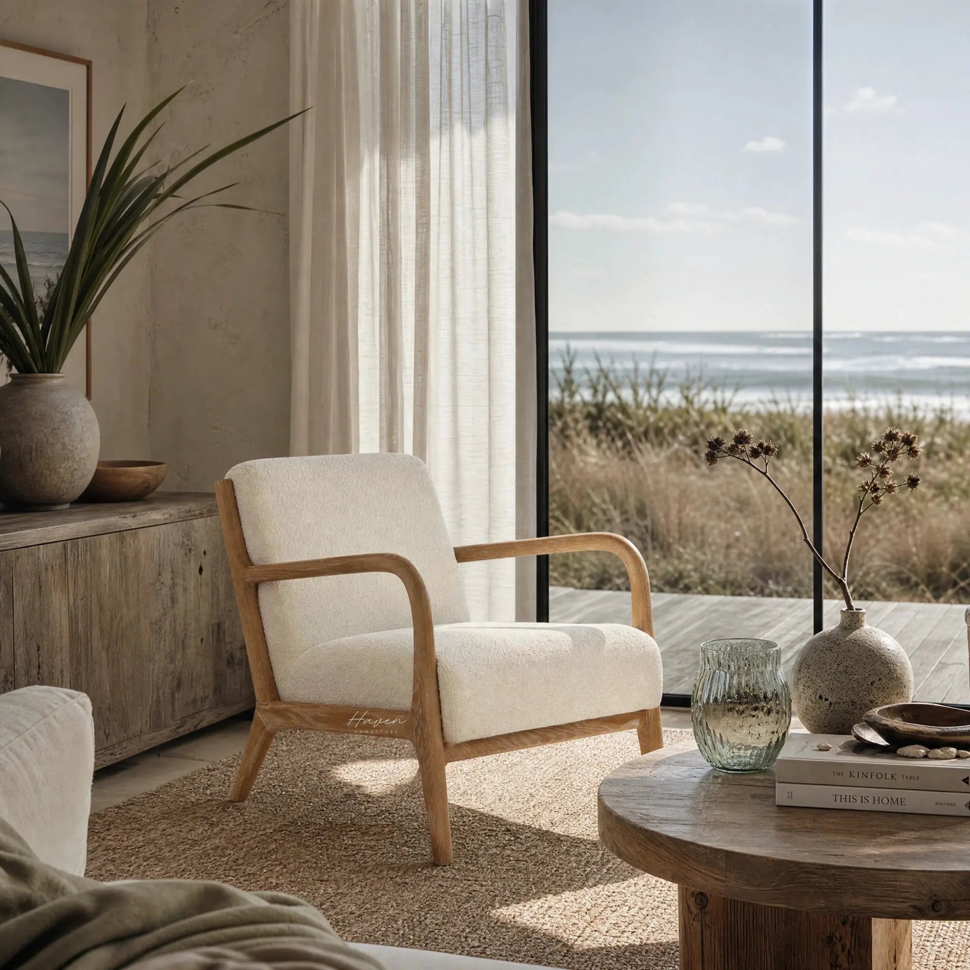 Pair of Tairua Lounge Chairs in Seafoam upholstery with limewashed oak frames in a coastal living room.