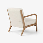 Tairua Lounge Chair in Seafoam upholstery with limewashed oak frame and curved arms.