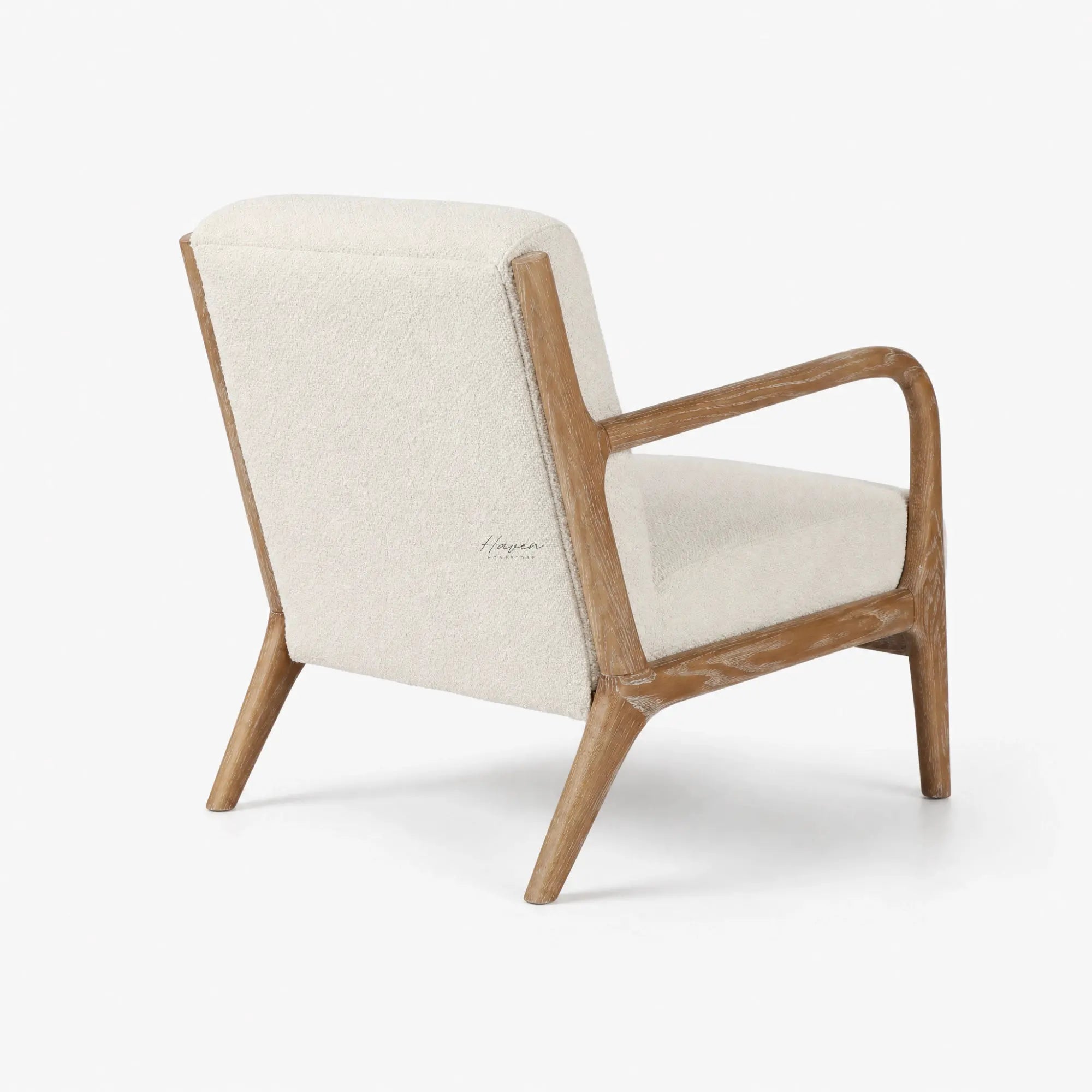 Tairua Lounge Chair in Seafoam upholstery with limewashed oak frame and curved arms.