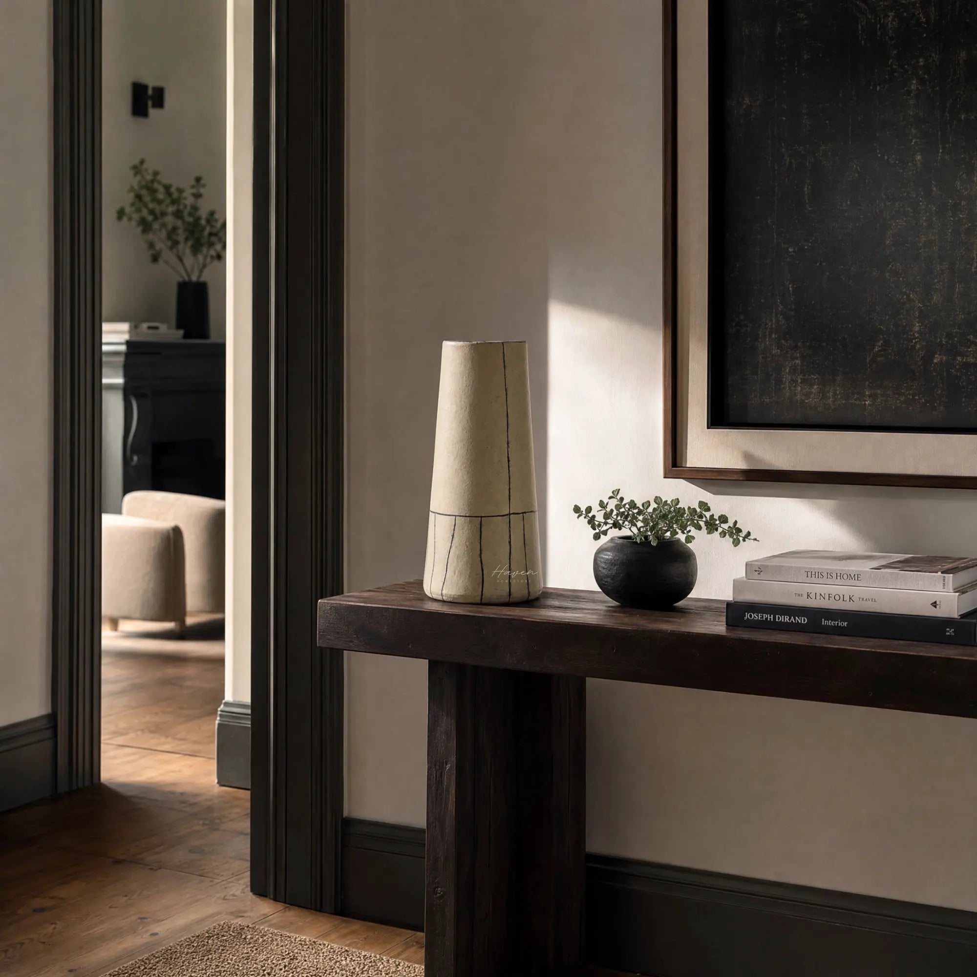 Line Vase: hand-thrown terracotta with bold painted lines on a dark wood console in a calm living room.