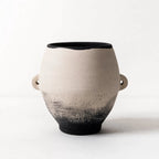 Himari Vase in hand-finished terracotta with a black rim, warm earthy tones, and a sculptural Japandi form.