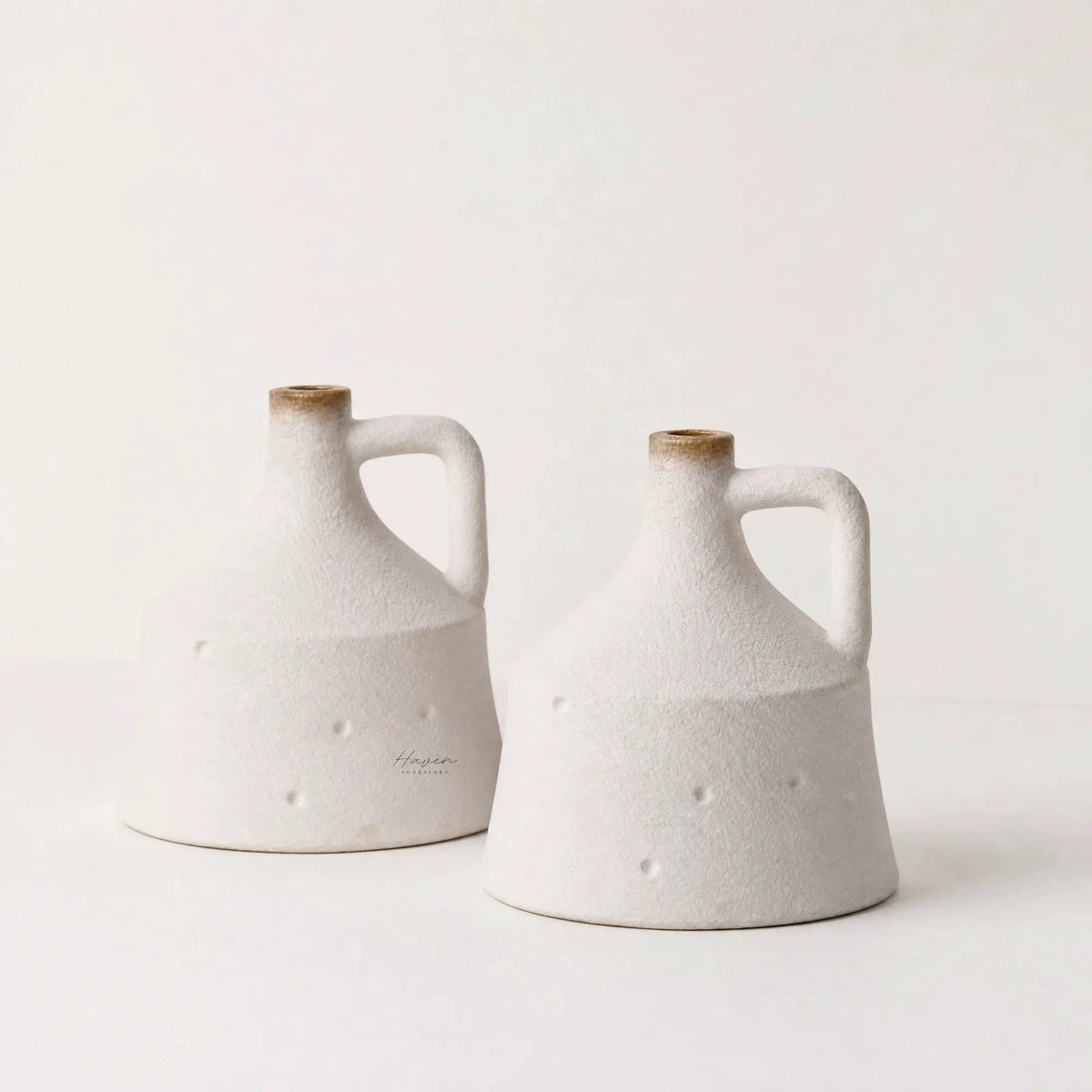 Yukina Vase Set/2: two handcrafted terracotta vases with textured surfaces and warm, natural finish.
