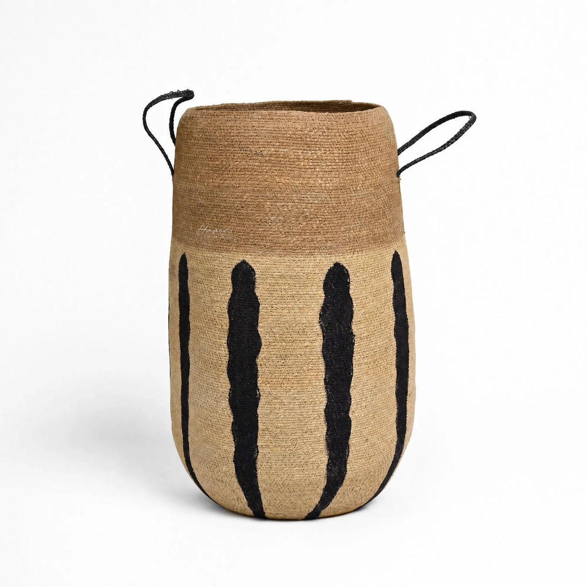 Aditi Basket handwoven from natural seagrass with bold black stripes and black cord handles.