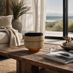Pari Basket Set/2: two handwoven seagrass baskets with denim stripe and mustard base on a rustic wooden table.