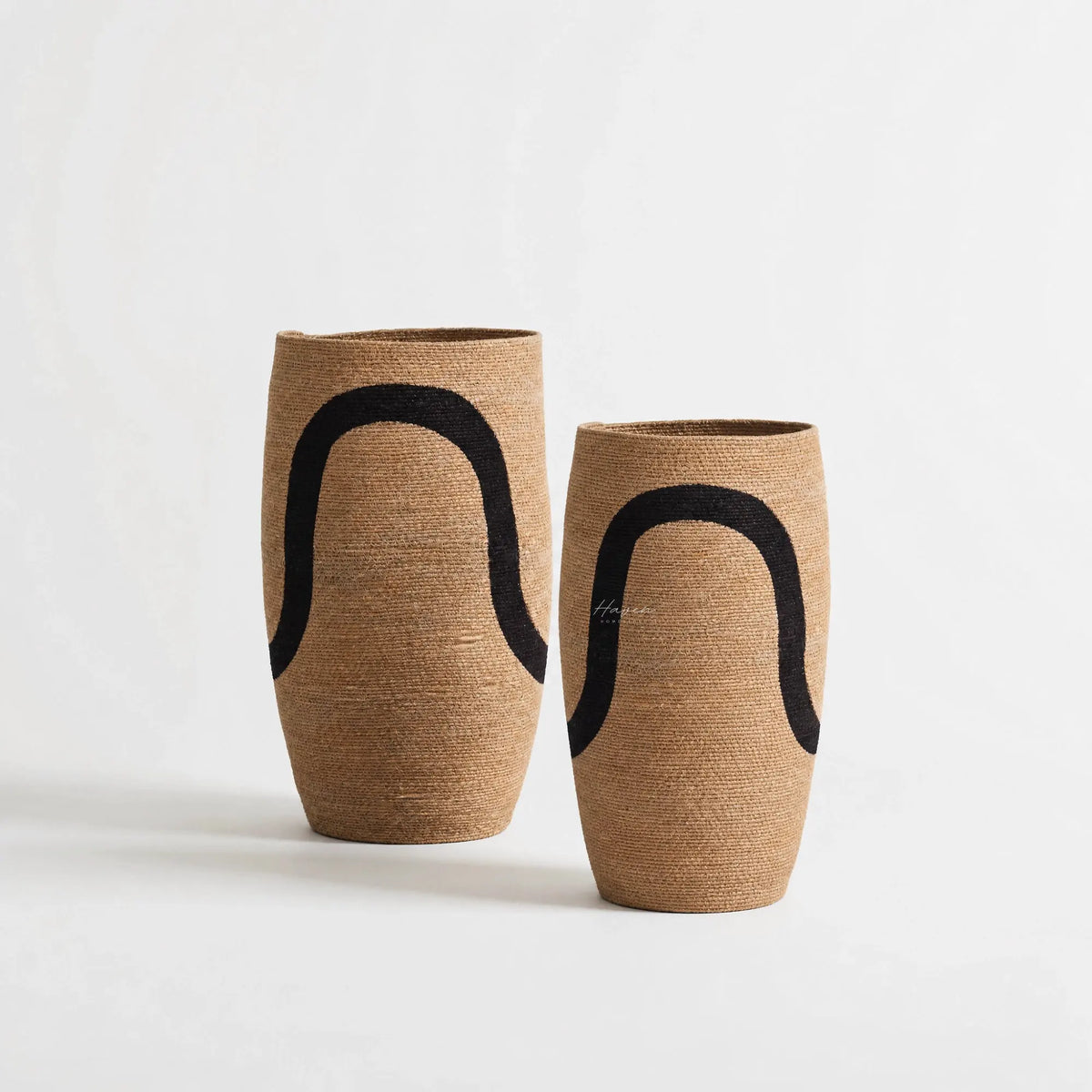 Sana Basket Set/2: two natural seagrass woven baskets with bold black curved motifs, handcrafted in India.