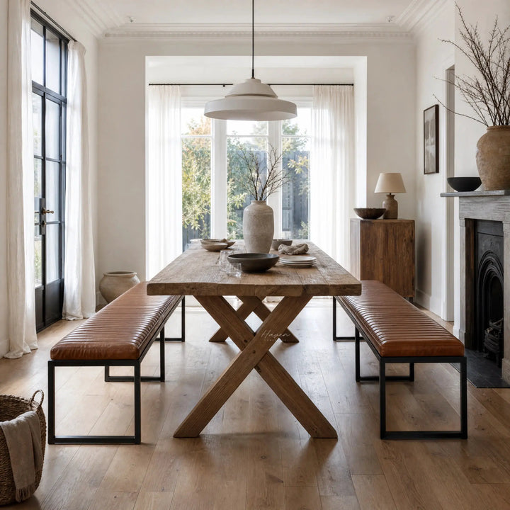 Pure Sabina benches with buffalo leather seats and matte black metal frames at a rustic dining table.