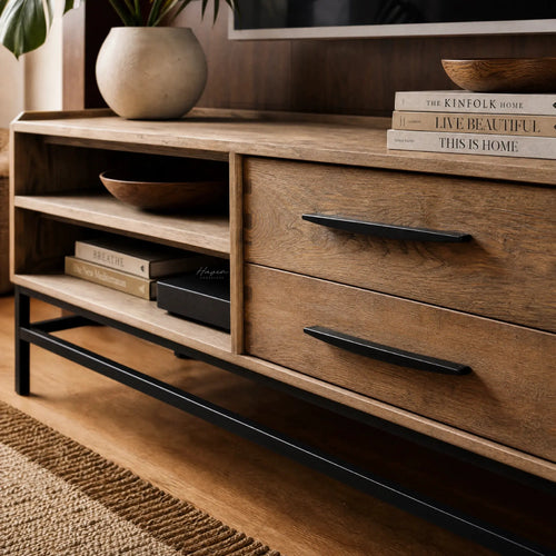 Atlas Entertainment Unit in natural oak with metal detailing, open shelves and drawers, styled with books and bowls.