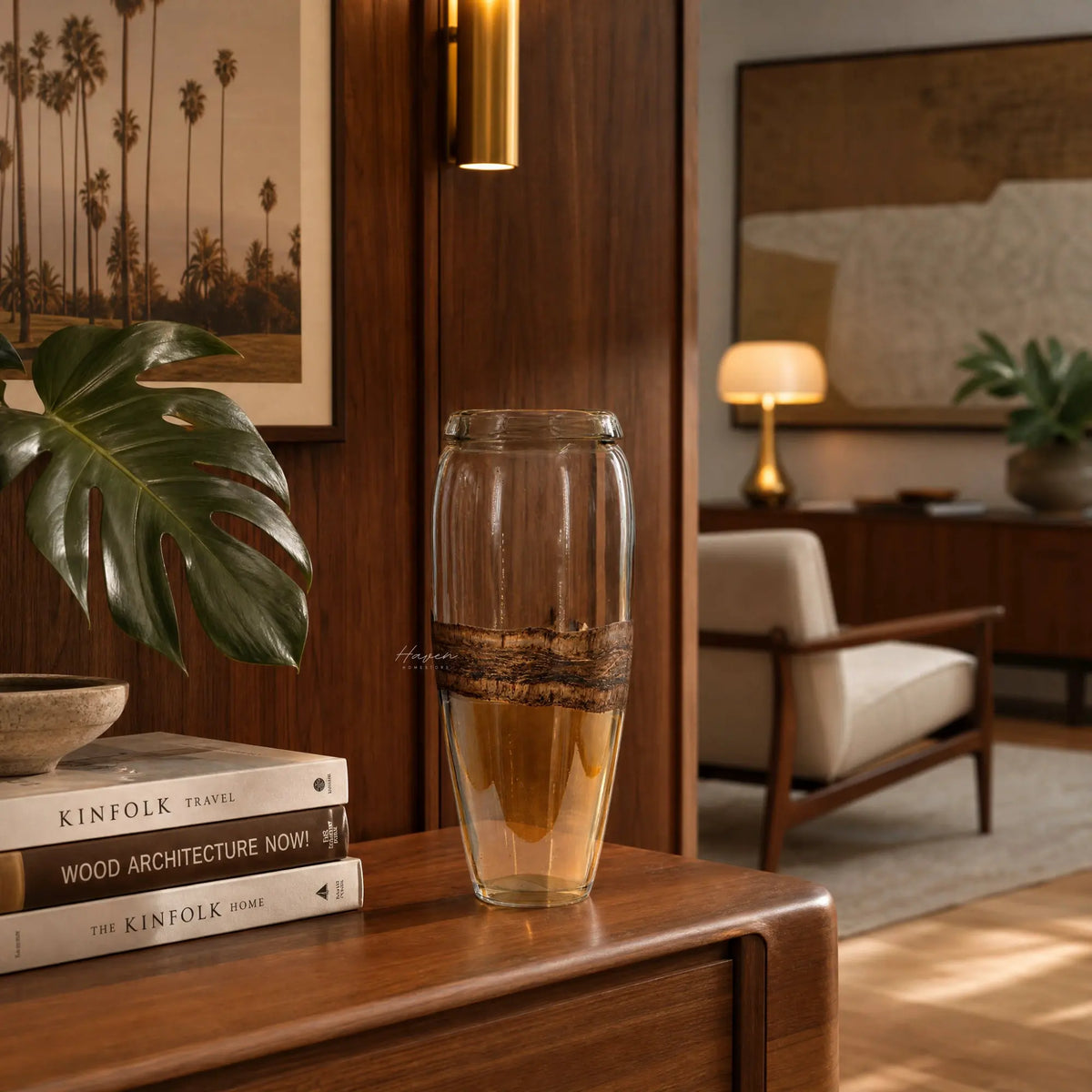 Desert Vase - Tall glass vase with flowing silhouette and layered amber glass on a wood shelf.