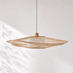 Soren Pendant Light with layered bamboo slat shade, diffusing warm light from a ceiling pendant.