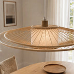 Soren Pendant Light handcrafted from bamboo with a circular slatted shade and linen diffuser, warm glow.