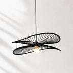 Halo Pendant Light featuring layered black circular hoops, a sculptural hanging fixture with a warm, diffused glow.