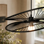 Halo Pendant Light, a handcrafted bamboo fixture with curved radiating spokes and warm, diffused light
