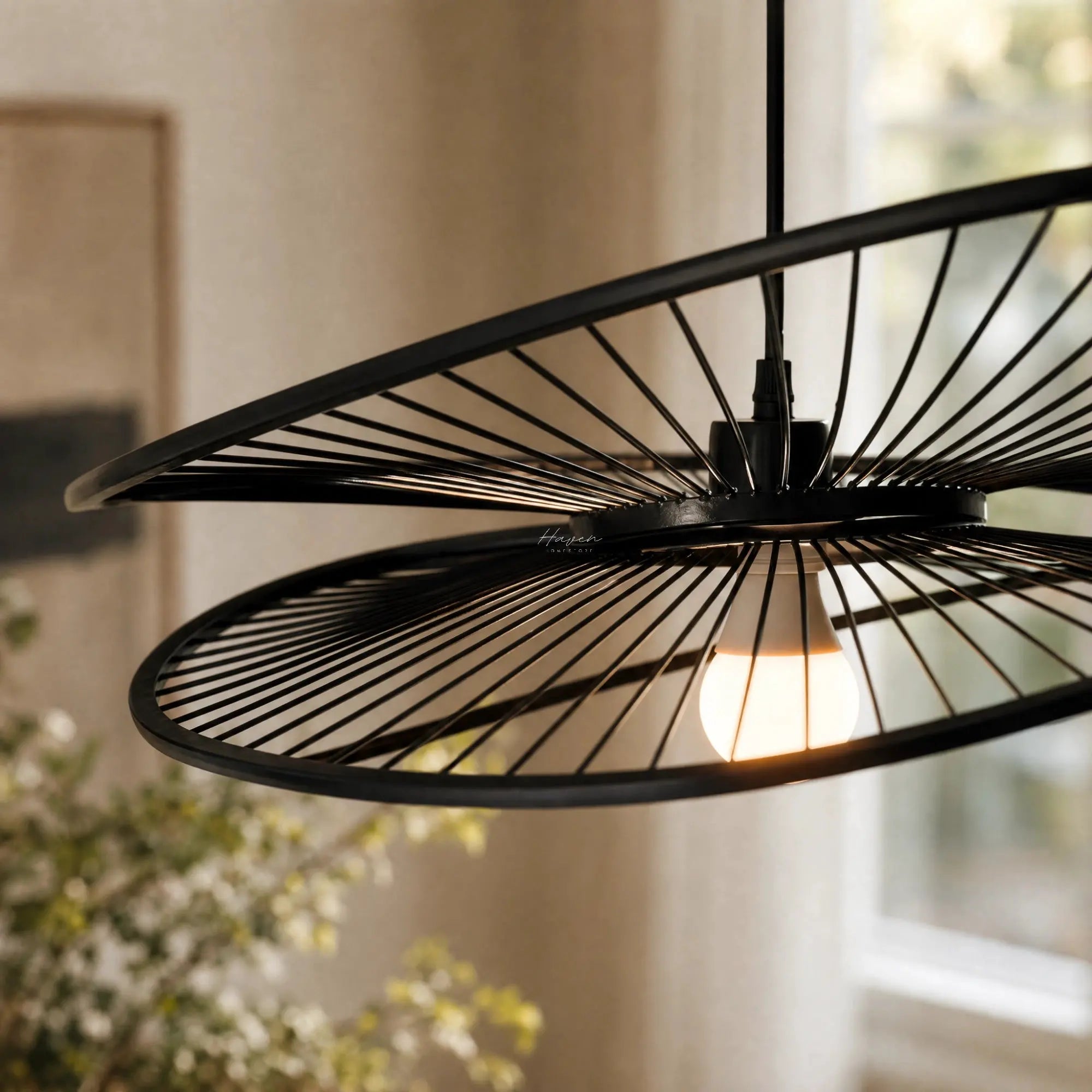 Halo Pendant Light, a handcrafted bamboo fixture with curved radiating spokes and warm, diffused light