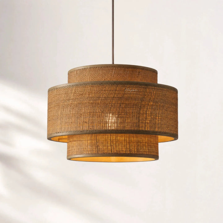 Loom Pendant Light with layered bamboo woven shades, hanging from a slim cord, warm Japandi-inspired glow.