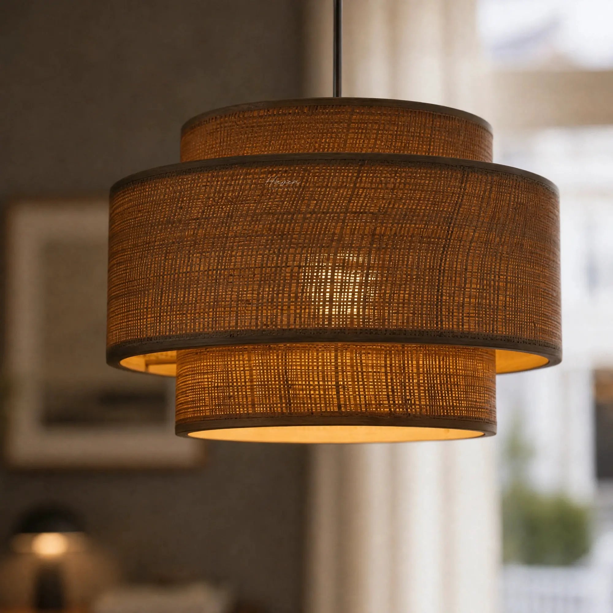 Loom Pendant Light with layered bamboo weave and warm Japandi glow over a dining table.