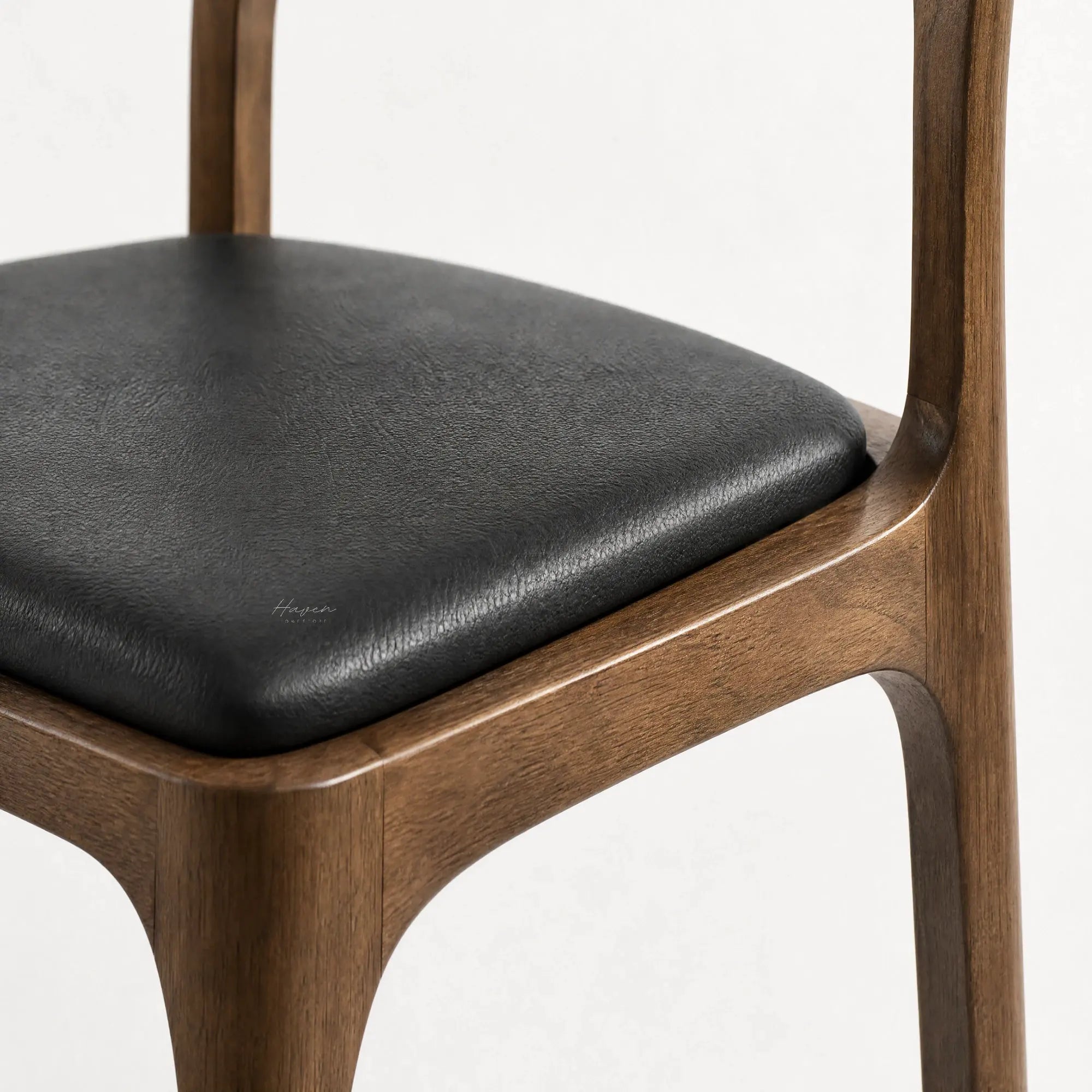 Ellison Dining Chair, Walnut finish with solid ash frame and black leather seat.