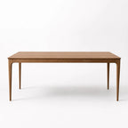 Ellison Dining Table with solid American Ash legs and veneer top in warm mid-century style.