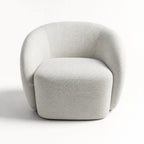 Ingrid Swivel Chair - Mist in soft textured light-gray fabric with a curved silhouette and plush cushioning.