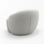 Ingrid Swivel Chair in Mist with soft curved silhouette, plush cushioning and textured poly-mix upholstery.