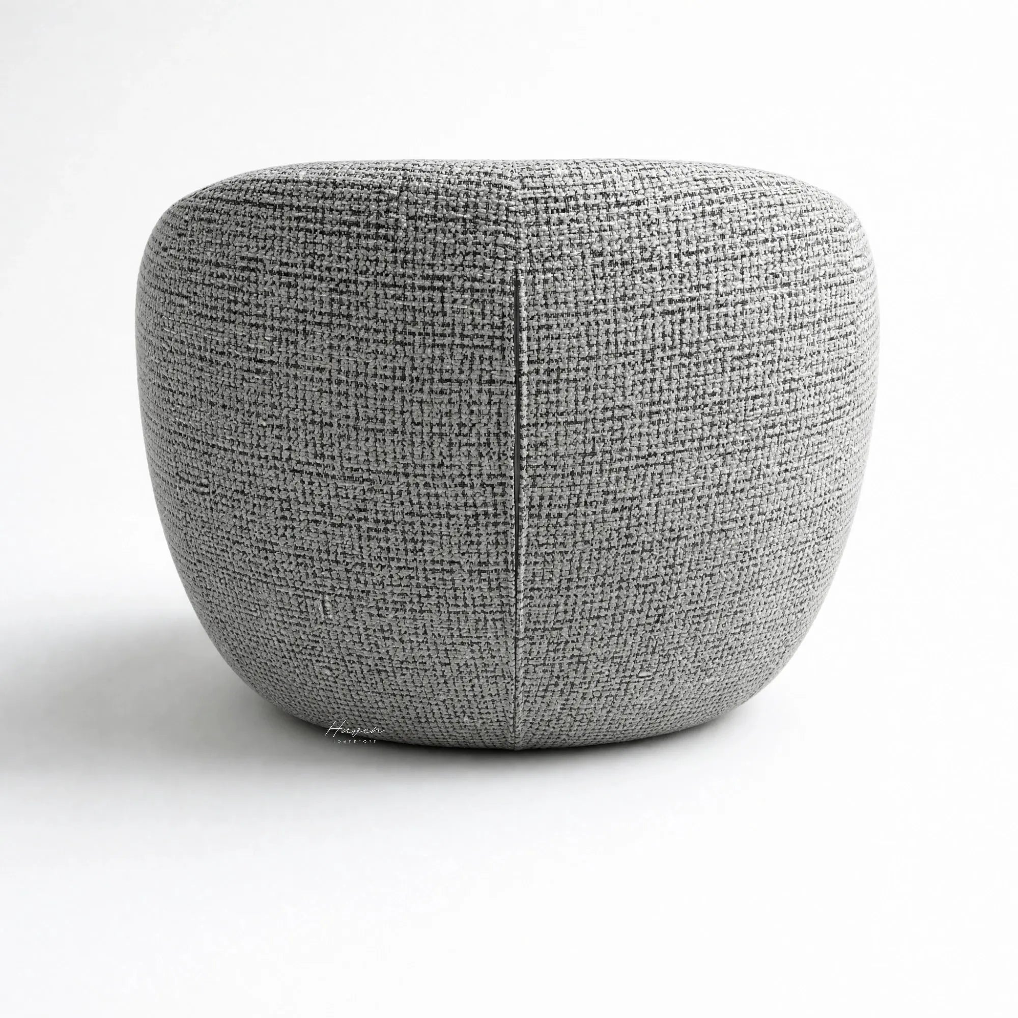 Ingrid Swivel Chair Frost close-up of textured grey fabric with a vertical seam and rounded upholstery.