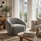 Ingrid Swivel Chair Frost with textured poly-mix upholstery and a soft curved silhouette in a cozy living room.